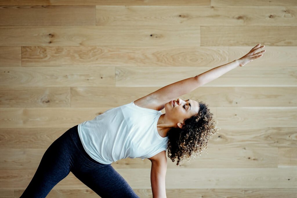 life-luster-wellness-austin-texas-yoga-pilates-melissa-diehl-instructor-Trikonasana Triangle Pose (Trikonasana) during a yoga session in Austin, Texas